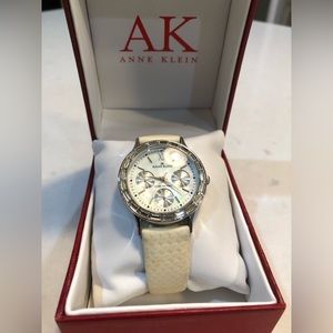 ANNE KLEIN Women’s Calendar Watch with Rectangular Crystals.  Creme Leather Band